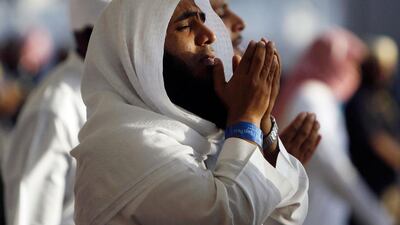 Muslim pilgrims pray after casting seven stones at a pillar that symbolises Satan, as part of a pilgrimage rite, on the second day of Eid al-Adha in Mina near the holy city of Mecca. Amr Abdallah Dalsh / Reuters