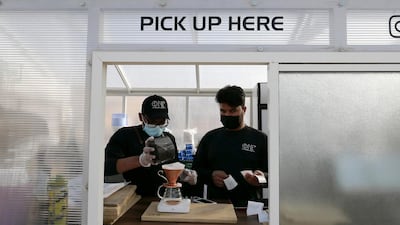 Staff prepare filter coffee at the One Degree Café in Margham area in Dubai. Pawan Singh / The National