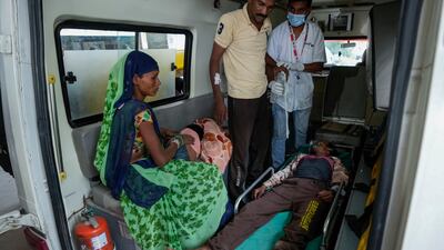 Rameshbhai Shankarbhai Rathva is brought to the civil hospital in Ahmedabad for treatment. AP