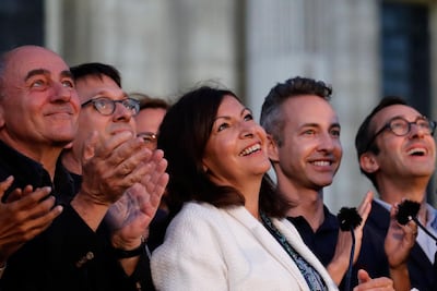 Paris mayor Anne Hidalgo (centre) won. AP