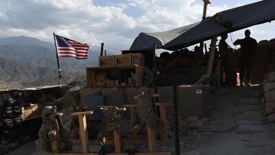 An American flag flies from a post in Afghanistan's Nangarhar province during an operation against ISIS militants. AFP