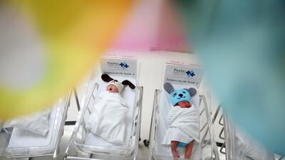 Newborn babies wearing dog costumes to celebrate the New Year of the Dog are pictured at the nursery room of Paolo Chokchai 4 Hospital in Bangkok, Thailand. Athit Perawongmetha / Reuters