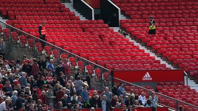 A sniffer dog patrols the stands after fans were evacuated from the ground prior to the Premier League match between Manchester United and AFC Bournemouth at Old Trafford on May 15, 2016 in Manchester, England. (Alex Morton/Getty Images)