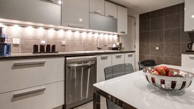 There is a closed kitchen and a separate laundry room, as well as a nearby bathroom with shower and guest bedroom. Courtesy Luxhabitat