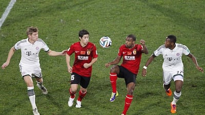 Guangzhou Evergrande’s Muriqui, second right, and Dario Conca, second left, fight for the ball with Bayern Munich’s David Alaba, right, and Toni Kroos during their Club World Cup match at Agadir Stadium on Tuesday. Louafi Larbi / Reuters