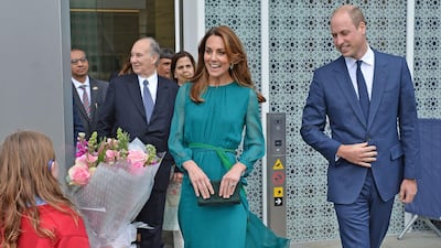 The children presented the Duchess of Cambridge with a bunch of flowers. AFP