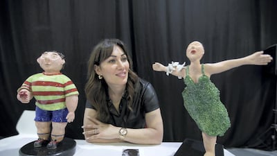 Artist Ankina Zakarian with her artworks at the World Art Dubai. Leslie Pableo / The National