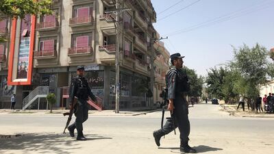 Afghan policemen arrive at the site of an attack in Kabul, Afghanistan. Reuters
