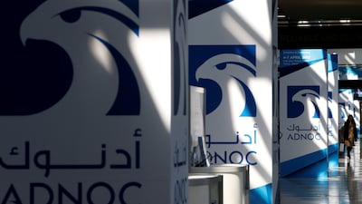 Adnoc logos at a previous Gastech event in Chiba, Japan. Dubai will host the global event this week. Reuters
