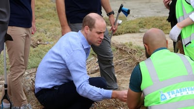 Britain's Duke of Cambridge Prince William talks to staff at Kuwait's Jahra Pools nature reserve, 35kms north of the Kuwaiti capital. AFP