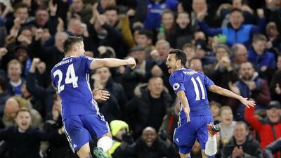 Pedro, right, celebrates after scoring Chelsea's equalising goal against Tottenham Hotspur on Saturday. Frank Augstein / AP Photo