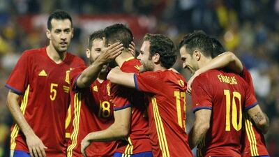 Mario Gaspar, centre, celebrates with teammates after scoring the opening goal. Morell / EPA