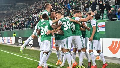 Rapid Vienna's player celebrate Taxiarchis Fountas' goal. AFP