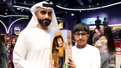 Mohammed and Zayed, 11, with a Woody toy