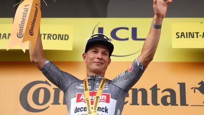 Alpecin-Deceuninck rider Jasper Philipsen celebrates on the podium after winning Stage 10 between Orleans and Saint-Amand-Montrond. AFP