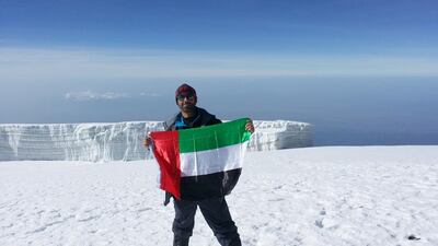Ahmed Al Suwaidi atop Mount Kilimanjaro. Courtesy of Ahmed Al Suwaidi