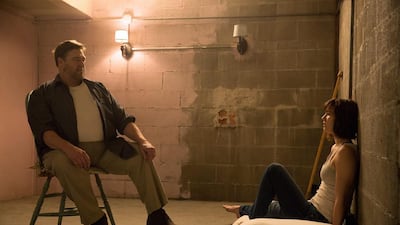 John Goodman and Mary Elizabeth Winstead in10 Cloverfield Lane. Michele K Short / Paramount Pictures via AP Photo