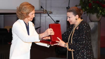 Abu Dhabi Music and Arts Foundation founder Huda Alkhamis Kanoo receives the Medal of Honour from Queen Sofia of Spain. Photo: Abu Dhabi Music and Arts Foundation