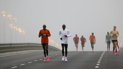 Kenya's Eliud Kipchoge, the marathon world record holder, warms up before the start of his attempt to run a marathon in under two hours in Vienna, Austria. REUTERS