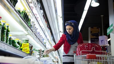 A shopper at an Abela Supermarket in Abu Dhabi. Silvia Razgova / The National