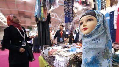 A visitor looks at Muslim women headwear inside an exhibition hall near Paris. Gonzalo Fuentes / Reuters