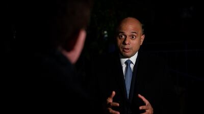 An anti-vax campaigner has been charged following a protest outside UK Health Secretary Sajid Javid's home in Fulham, south London. PA
