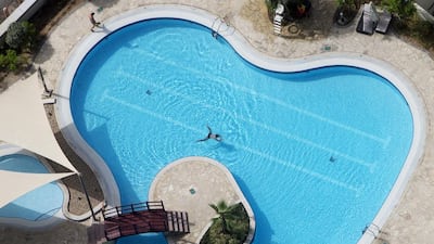 The view from above: A Gate Tower resident swims in the pool. Christopher Pike / The National