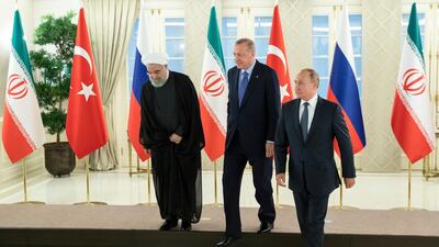 Iranian President Hassan Rouhani, Turkish President Recep Tayyip Erdogan and Russian President Vladimir Putin after posing for a photo in Ankara. AP Photo