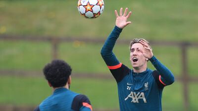 Liverpool's defender Kostas Tsimikas trains on Monday. AFP