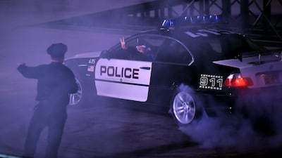 Members of the US Police Academy perform during a drift event at the Riyadh Motor Show at Al-Janadriyah village in the Saudi capital. AFP