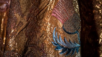 The Imperial Mantle is adorned with colourful motifs such as fleur-de-lis and imperial eagles