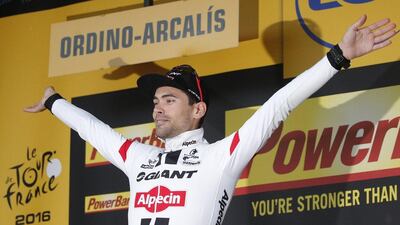 Stage winner Netherlands’ Tom Dumoulin celebrates on the podium after the ninth stage of the Tour de France cycling race over 184.5km with start in Vielha Val d’Aran, Spain, and finish in Andorra Arcalis, Andorra, Sunday, July 10, 2016. Christophe Ena / AP Photo