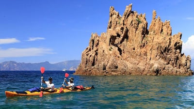 T Racers ride kayaks during the 20th Corsica Raid race in Porto on the French island of Corsica. One hundred and twenty-one competitors from 12 countries will participate at the 20th edition of the Corsica Raid Aventure, one of the toughest of the combined extreme sport events in the world. Pascal Pochard-Casabianca / AFP