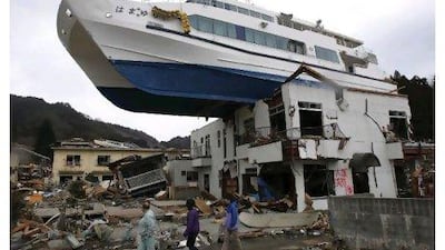 A boat sits atop a building in Otsuchi, Japan, after earthquake and tsunami which devastated a vast area of the country.