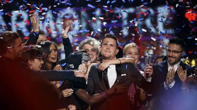 Singer Trent Harmon is congratulated after winning the competition during the American Idol grand finale. Mario Anzuoni / Reuters