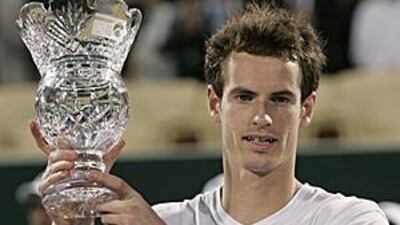 Andy Murray with his trophy after he defeated the world number one Rafael Nadal to win the Capitala World Tennis Championship in Abu Dhabi.