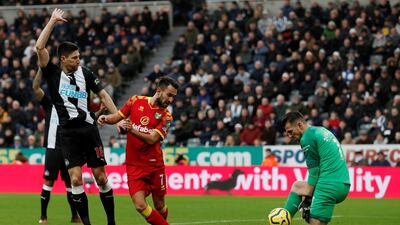Newcastle United goalkeeper Martin Dubravka saves a shot from Norwich City's Lukas Rupp. Reuters