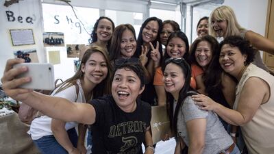 A group of Filipina domestic workers in Hong Kong. Remittances from overseas workers are a mainstay of the Philippines economy. Dale De La Rey/ AFP