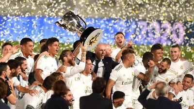 Real Madrid players lift the La Liga trophy after their win over Villarreal. Getty