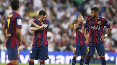 Barcelona's Lionel Messi, left, and Neymar, right, react during their La Liga loss to Real Madrid on Saturday in the season's first 'El Clasico' meeting. Juan Medina / Reuters