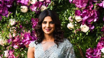 Bollywood actress Priyanka Chopra poses for photographs as she arrives to attend the wedding ceremony of Akash Ambani, son of Indian businessman Mukesh Ambani, in Mumbai on March 9, 2019. Photo: AFP
