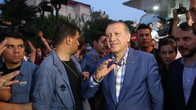 Turkish president Recep Tayyip Erdogan waves to supporters in front of his residence in Istanbul on June 16, 2016, after a failed coup attempt by a section of the military. EPA