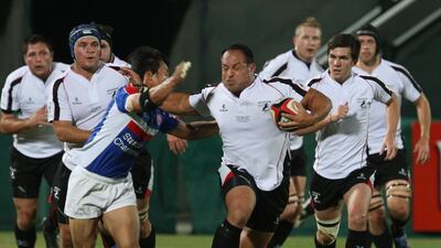 Arabian Gulf's Michael Riley, centre, on the charge against Korea in the Asian Five Nations international match at The Sevens in Dubai on May 14, 2010. Randi Sokoloff / The National