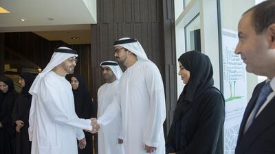 Sheikh Mohammed bin Zayed greets a guest during a moral education forum in Abu Dhabi. Mohammed Al Hammadi / Crown Prince Court - Abu Dhabi