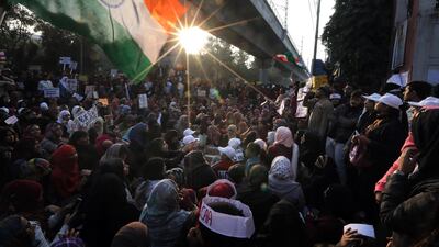 Indian activists hold placards and shout slogans as they protest against Citizen Amendment Act(CAA) outside Jamia Millia Islamia University, in New Delhi. EPA