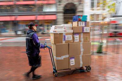 A worker delivers packages in Union Square, San Francisco, in December following improved US retail sales in November. Bloomberg