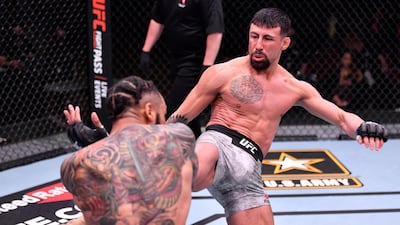 Chris Gutierrez, right, kicks Andre Ewell in their 140-pound catchweight fight during the UFC 258 event at UFC APEX in Las Vegas, Nevada. Jeff Bottari / Zuffa LLC / UFC