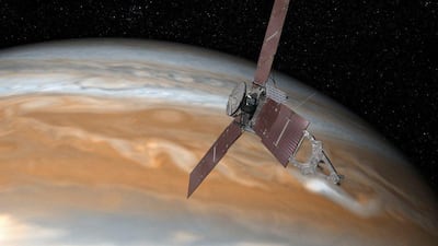 An artist’s rendering of Nasa’s Juno spacecraft making one of its close passes over Jupiter. Nasa via EPA