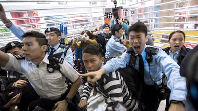 Police shout at protesters during a demonstration inside a shopping mall in Hong Kong on February 15, 2015. Anti-mainland Chinese demonstrators on Sunday protested against parallel traders and confronted police, government radio reported. Tyrone Siu / Reuters