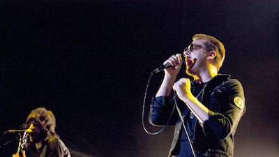 Sergio Pizzorno, left, and Tom Meighan, of the band Kasabian in concert at Dubai rugby Sevens grounds in 2012. Duncan Chard for the National
